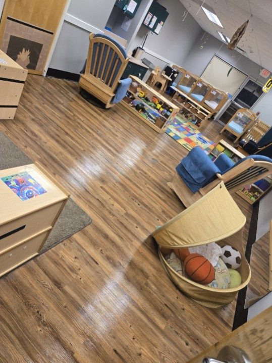 Daycare playroom with wood-look floors cleaned and polished by AICS